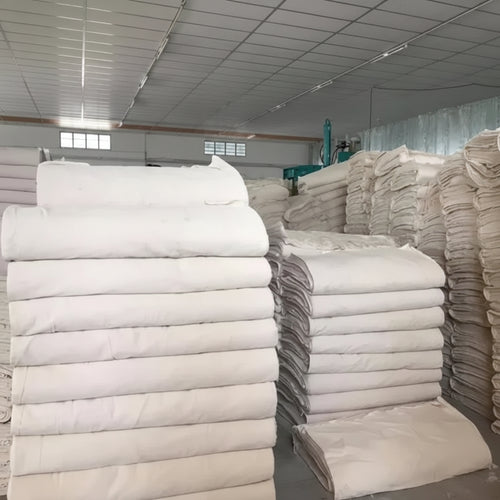 Textile cloth collection featuring checked matress fabric, cotton blend materials, and greige fabric. As a specialist textile cloth supplier, we provide powerloom fabric, woven interlining fabric, cotton dhoti, and cotton industrial fabric like majarpat for wholesale orders.